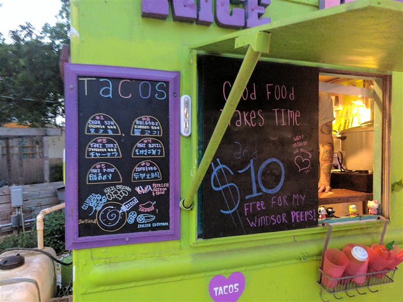 A brightly painted taco truck