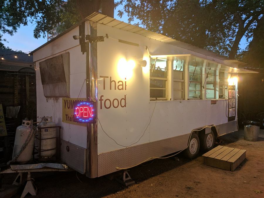 A food truck open for business in the evening